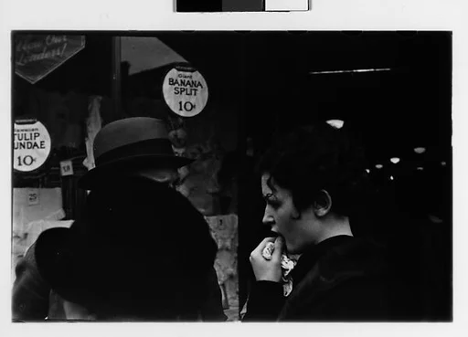 [Two 35mm Film Frames: Man and Two Women in Conversation on Street Outside Newberry's, New York City?]