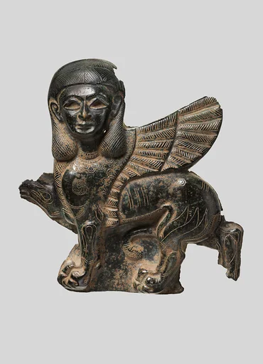 Plaque in the form of a sphinx