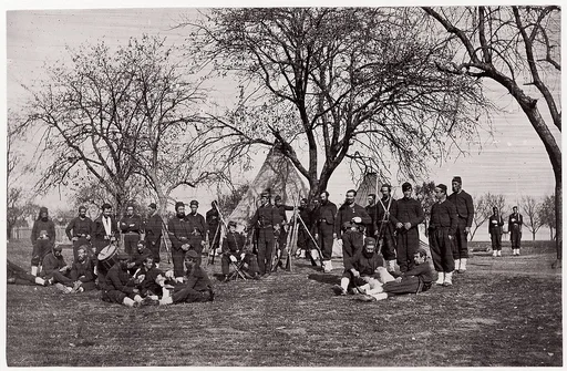 [Zouave Unit of 164th New York Infantry Beneath Trees in Tented Camp]
