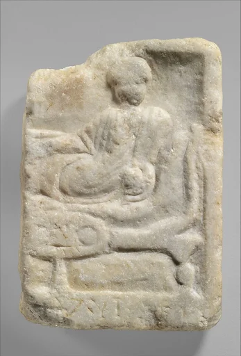Fragment of a marble votive relief dedicated to a hero
