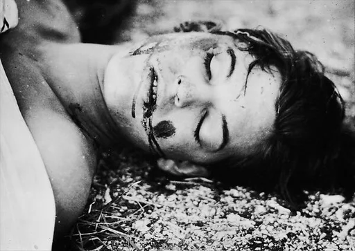 [Copy of Newspaper File Photograph: Corpse of Gonzalez Rubeira on Ground with Blood-Stained Face, Havana]