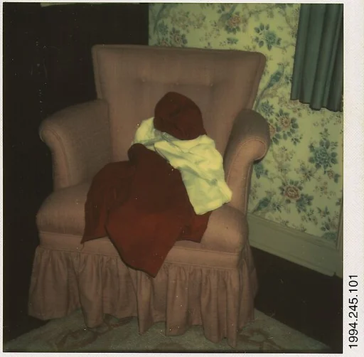 [Clothes Draped on Armchair]
