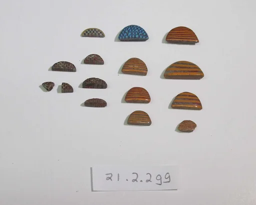 Inlay elements from shrine: semi-circles with various patterns (loaves or baskets)