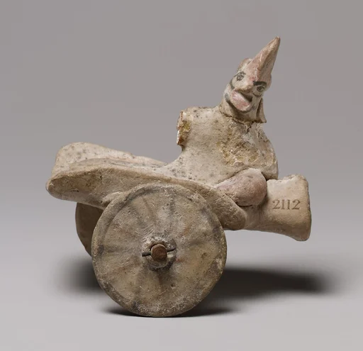 Model of a cart with a human figure
