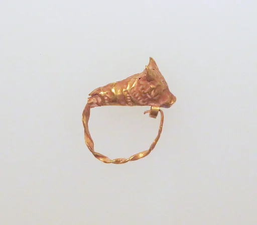Gold earring with head of a bull