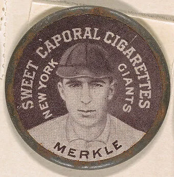 Merkle, New York Giants (black), from the Domino Discs series (PX7), issued by Kinney Brothers — Kinney Brothers Tobacco Company