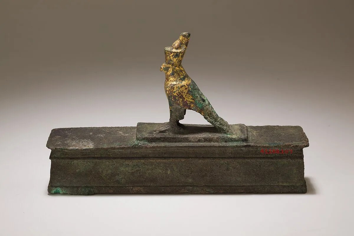 Falcon in double crown surmounting a shrine shaped box for an animal mummy — Unknown