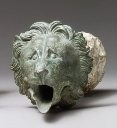 Bronze water spout with lion mask (one of a pair)