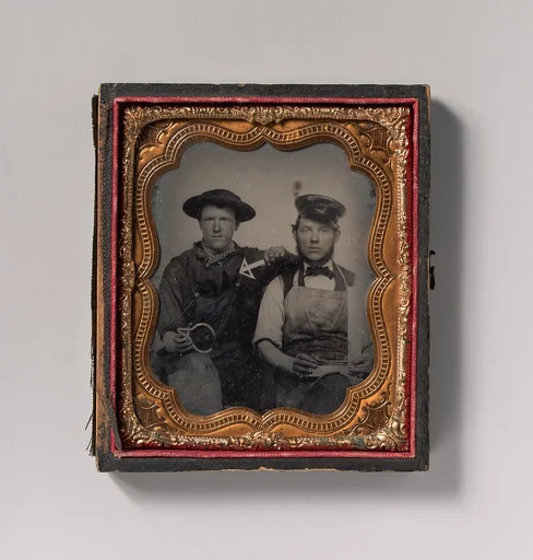 [Two Seated Men with Calipers, T-Square, and Compass]