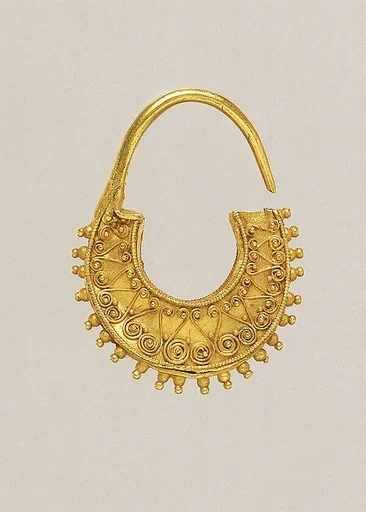 Gold crescent-shaped earring