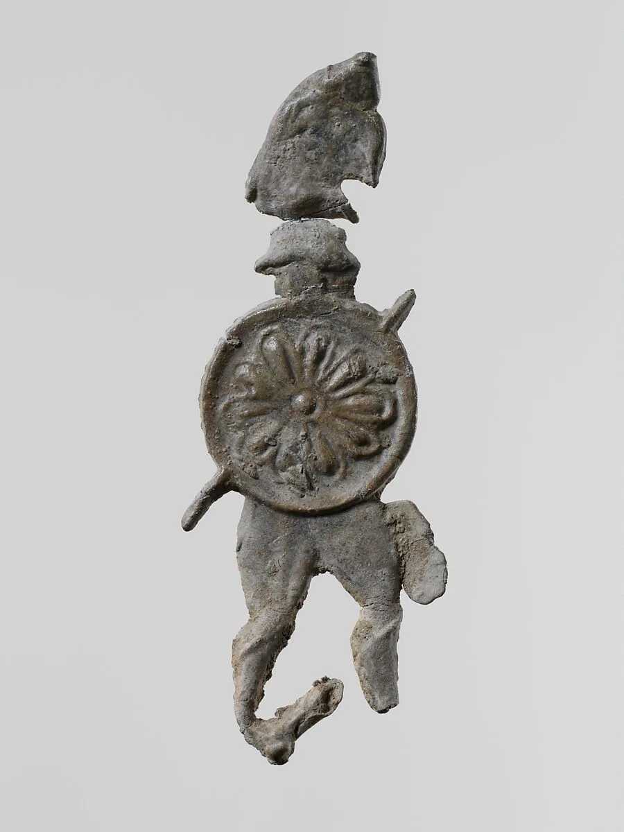 Lead figure of a warrior with a helmet and shield — Unknown