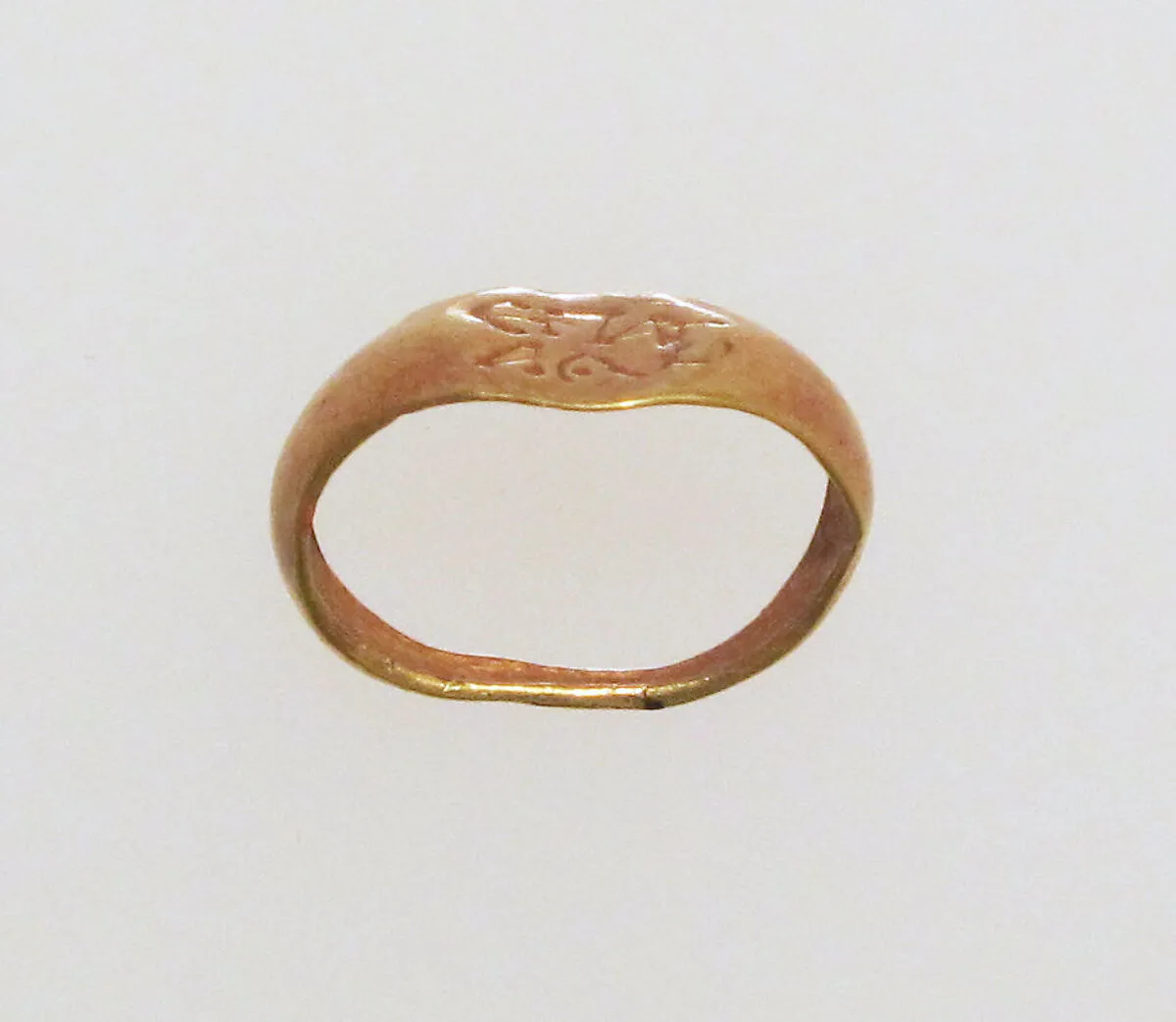 Gold ring with inscribed bezel — Unknown