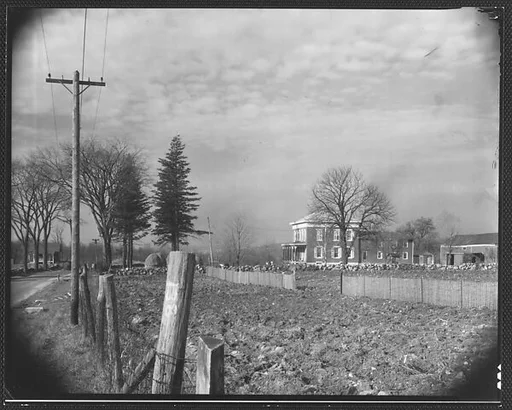 [Greek Revival House From Road with Fencepost in Foreground, Brewster, New York]
