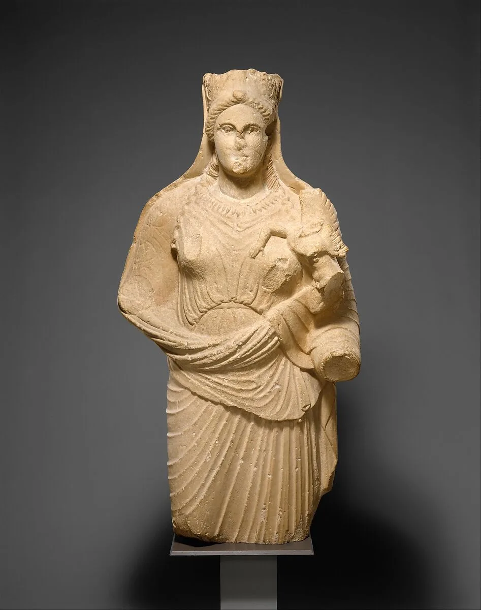 Limestone statue of Aphrodite holding winged Eros — Unknown