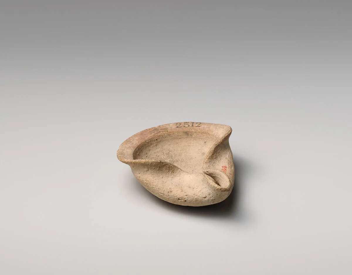 Terracotta saucer-shaped lamp — Unknown