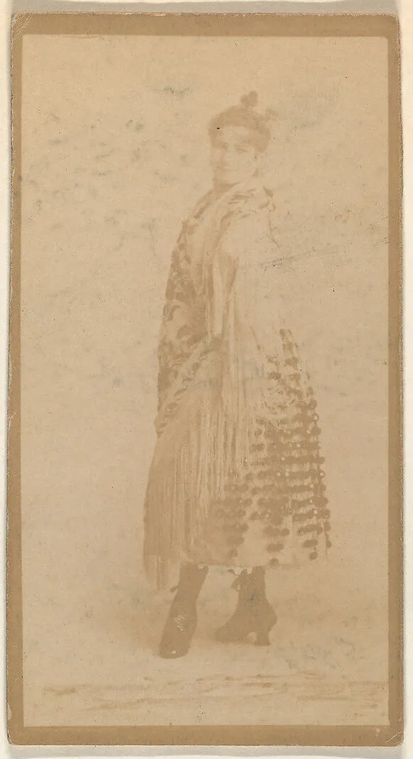Standing actress wrapped in shawl, from the Actresses series (N668) — Unknown