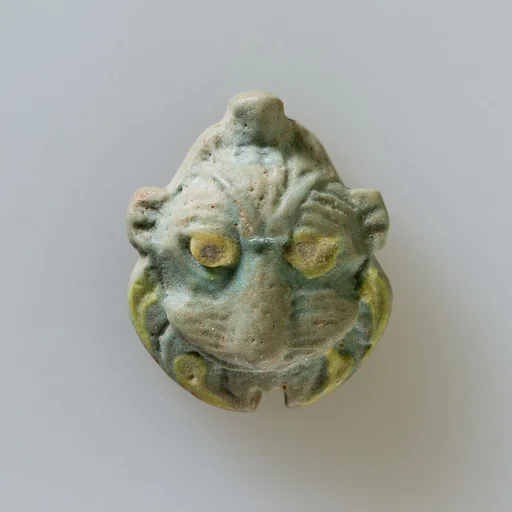 Lion head amulet