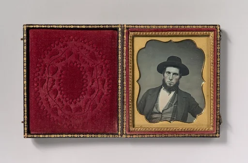 [Bewhiskered Man in Hat and Plaid Vest]