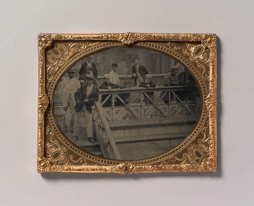 [Group of Men and Boys Standing Along the Railing of the Fulton Street Bridge]