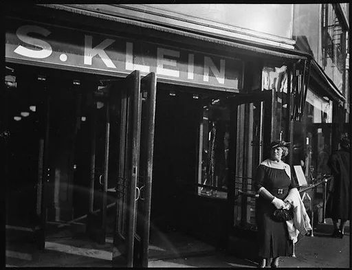 [Woman Outside Entrance of S. Klein-on-the-Square Department Store, Union Square East, New York City]