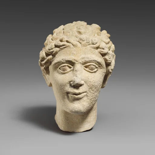 Limestone head of a beardless male votary
