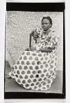 Young Woman Seated in Apple Print Dress — Seydou Keïta