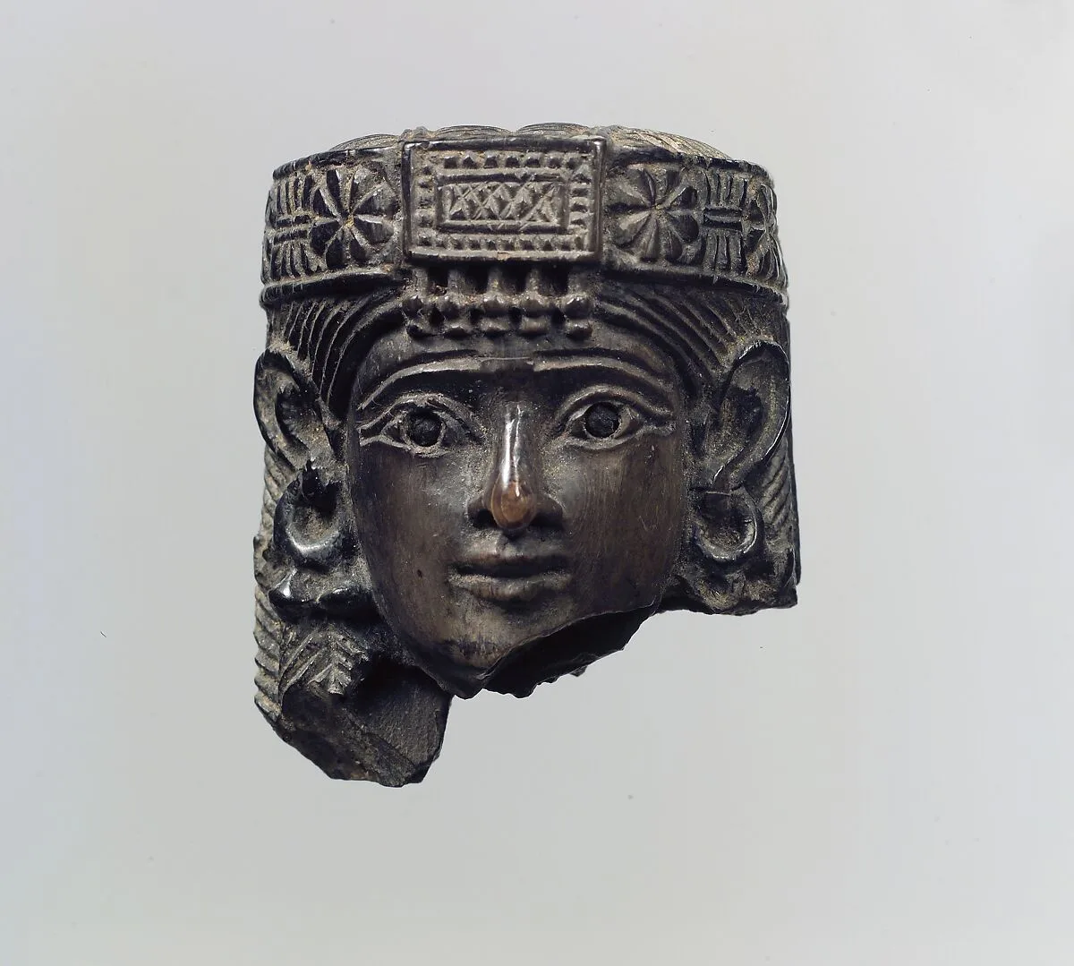 Head of a female figure — Unknown