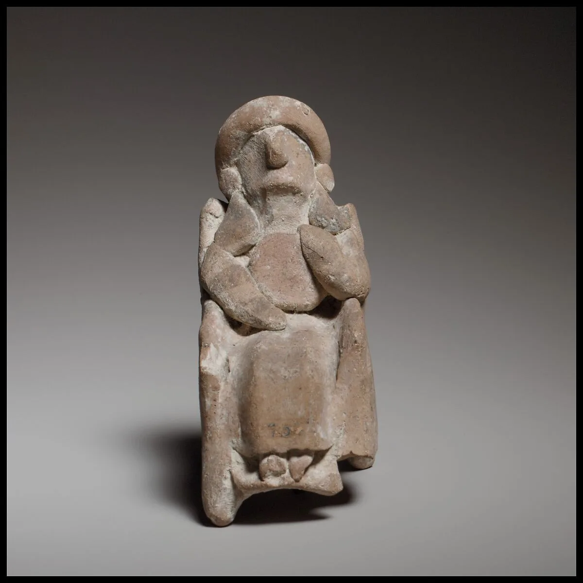 Seated female figurine — Unknown