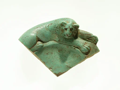 Fragment of a dish with a lion reclining on the rim