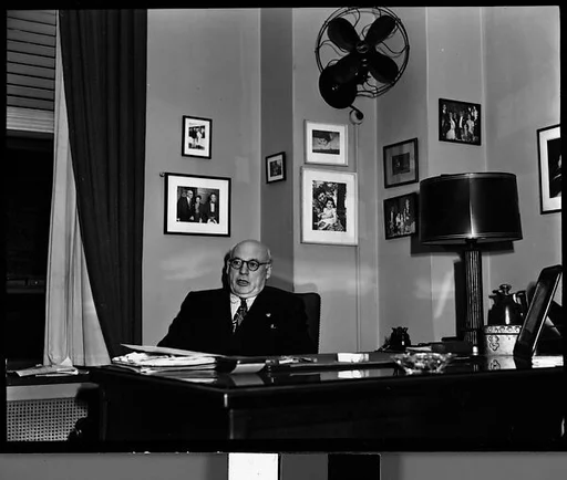 [Sol Hurok Seated at Desk, New York City]