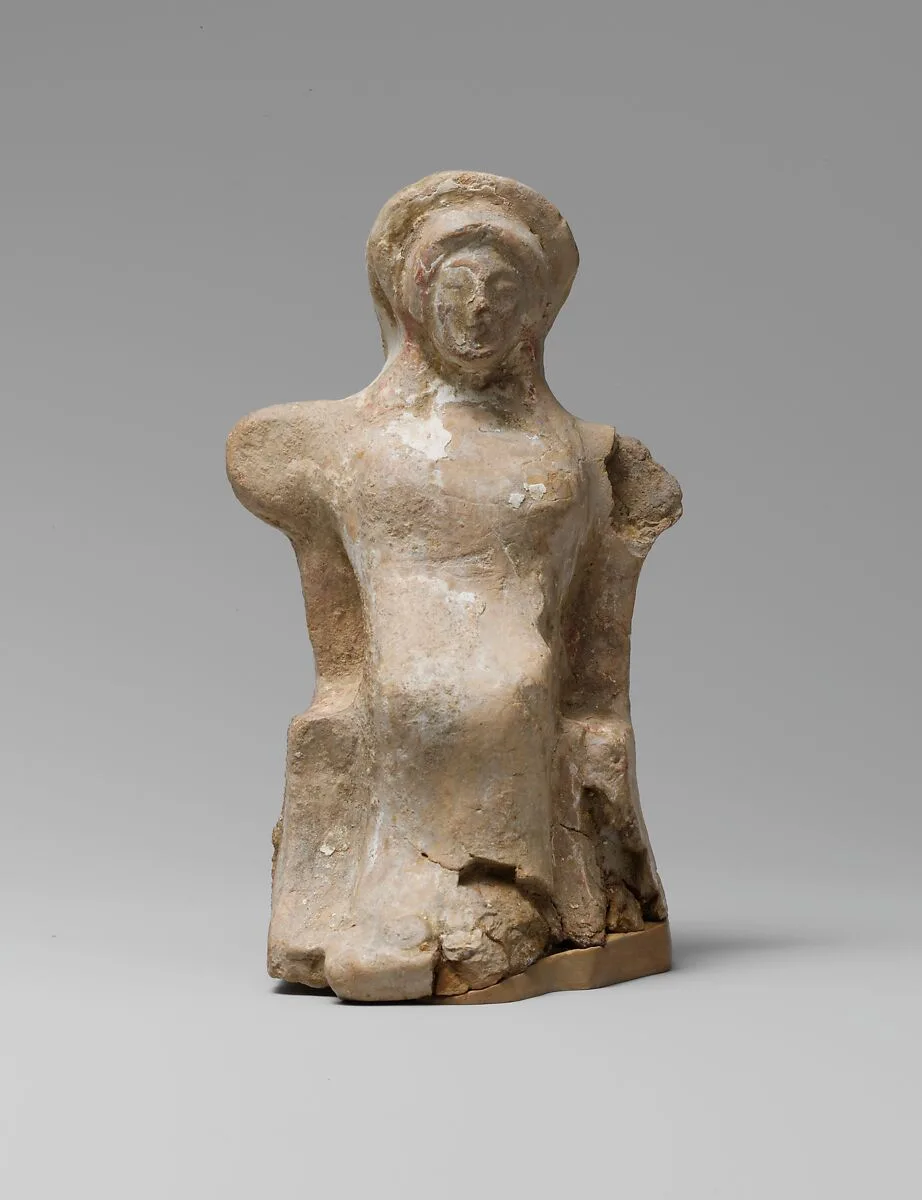 Terracotta statuette of a seated woman — Unknown