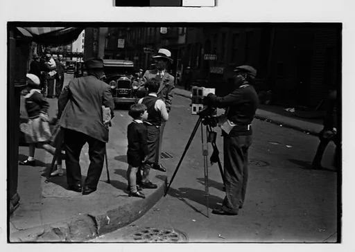 [Two 35mm Film Frames: Tintype Photographer and Group on Street Corner, New York City]