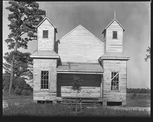 [Double-Steepled Wooden Church with Sapling Planted in Front, Alabama]