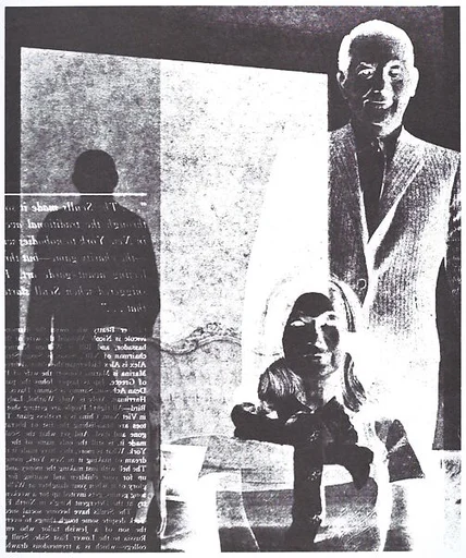 [Man in Suit Standing Behing Seated Woman in Suit]