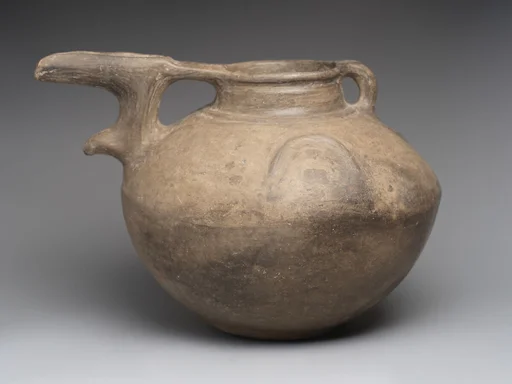 Bridge-spouted pitcher