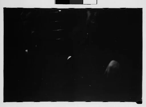 [Five 35mm Film Frames: Subway Passengers, New York City: Man, Woman, Man in Hat and Plaid Workcoat]