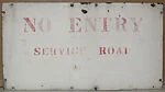 [Rusted Metal Sign: "No Entry, Service Road"]