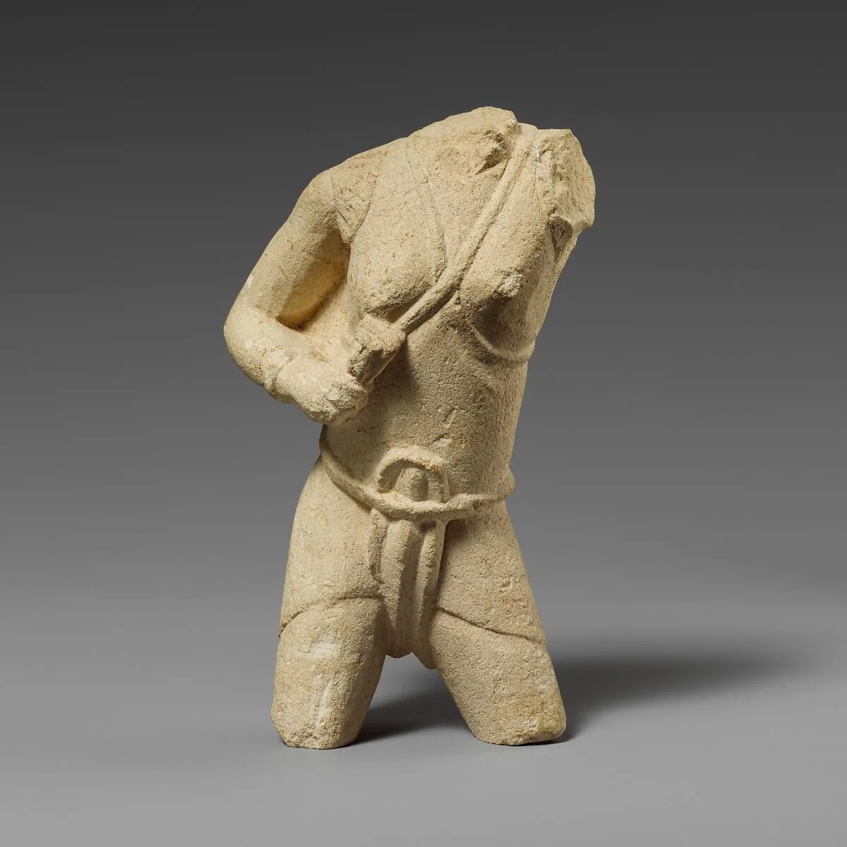 Torso of a limestone fighting woman — Unknown