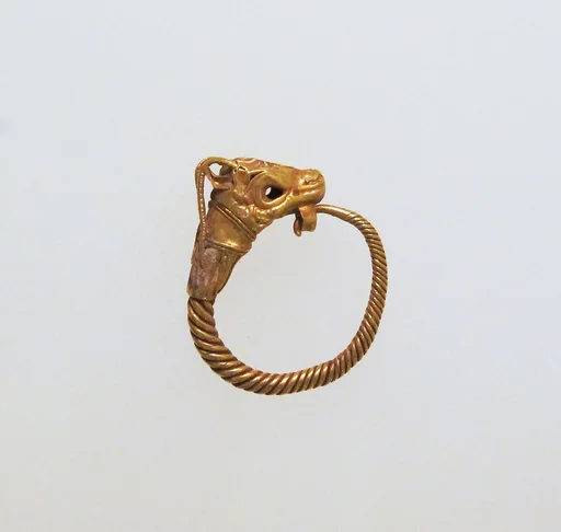 Gold earring with head of a goat