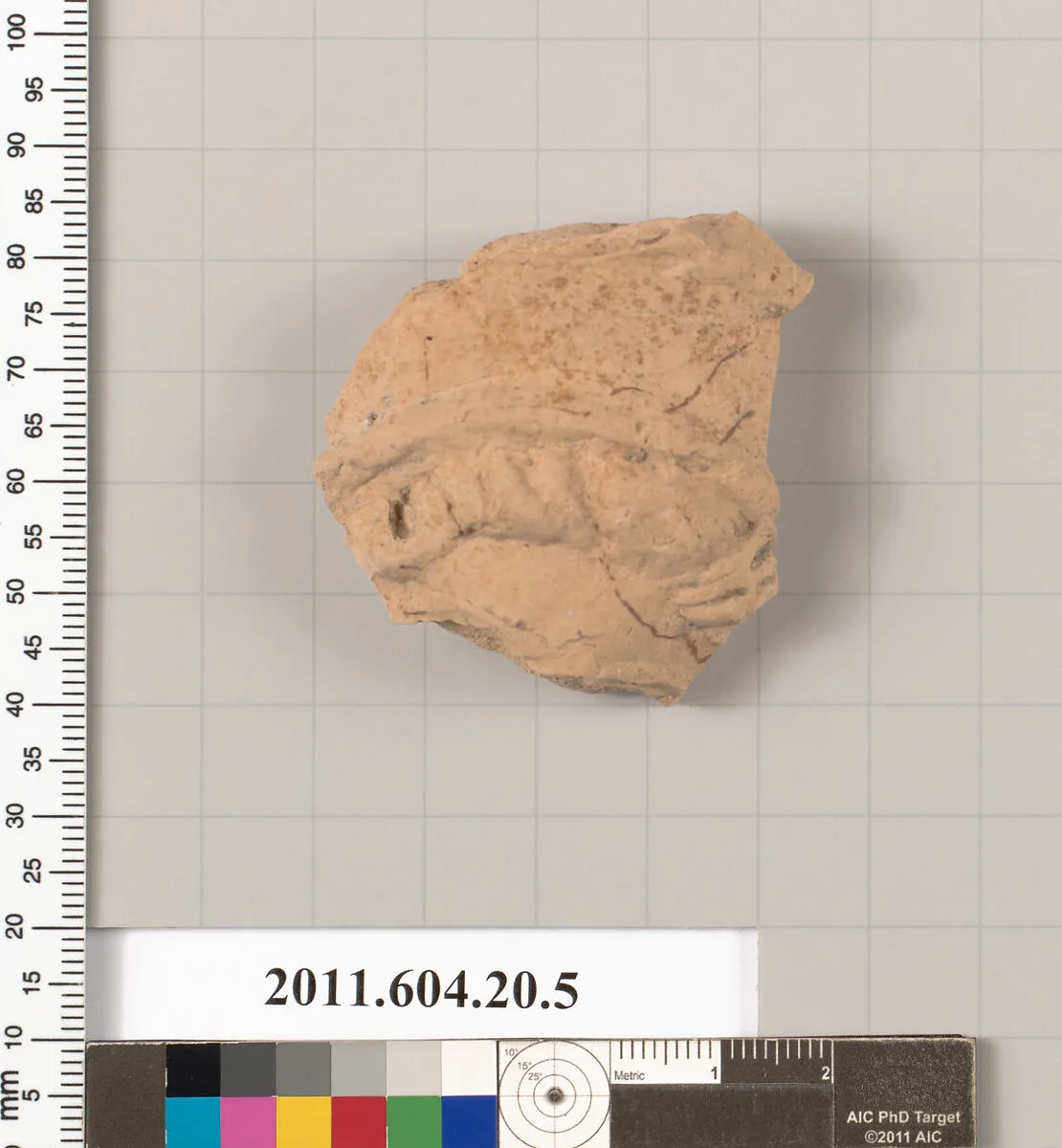 Fragment of a statuette of a woman — Unknown