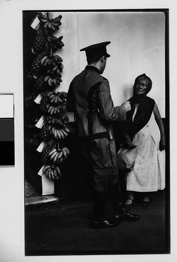 [Policeman Speaking to Fruit Vendor on Street, Havana]