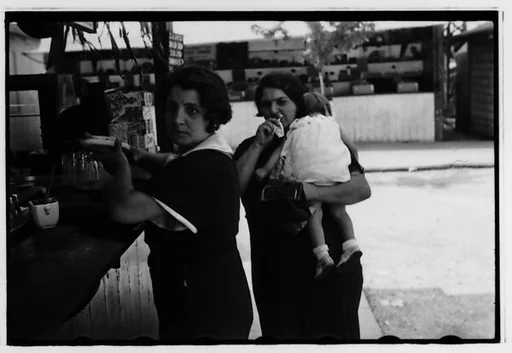 [Two 35mm Film Frames: Women and Children at Amusement Park Food Stand]