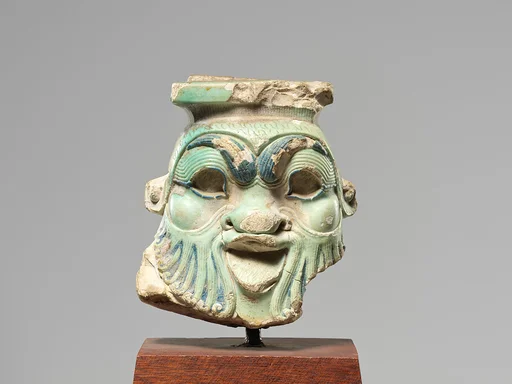 Head from a Bes Jar