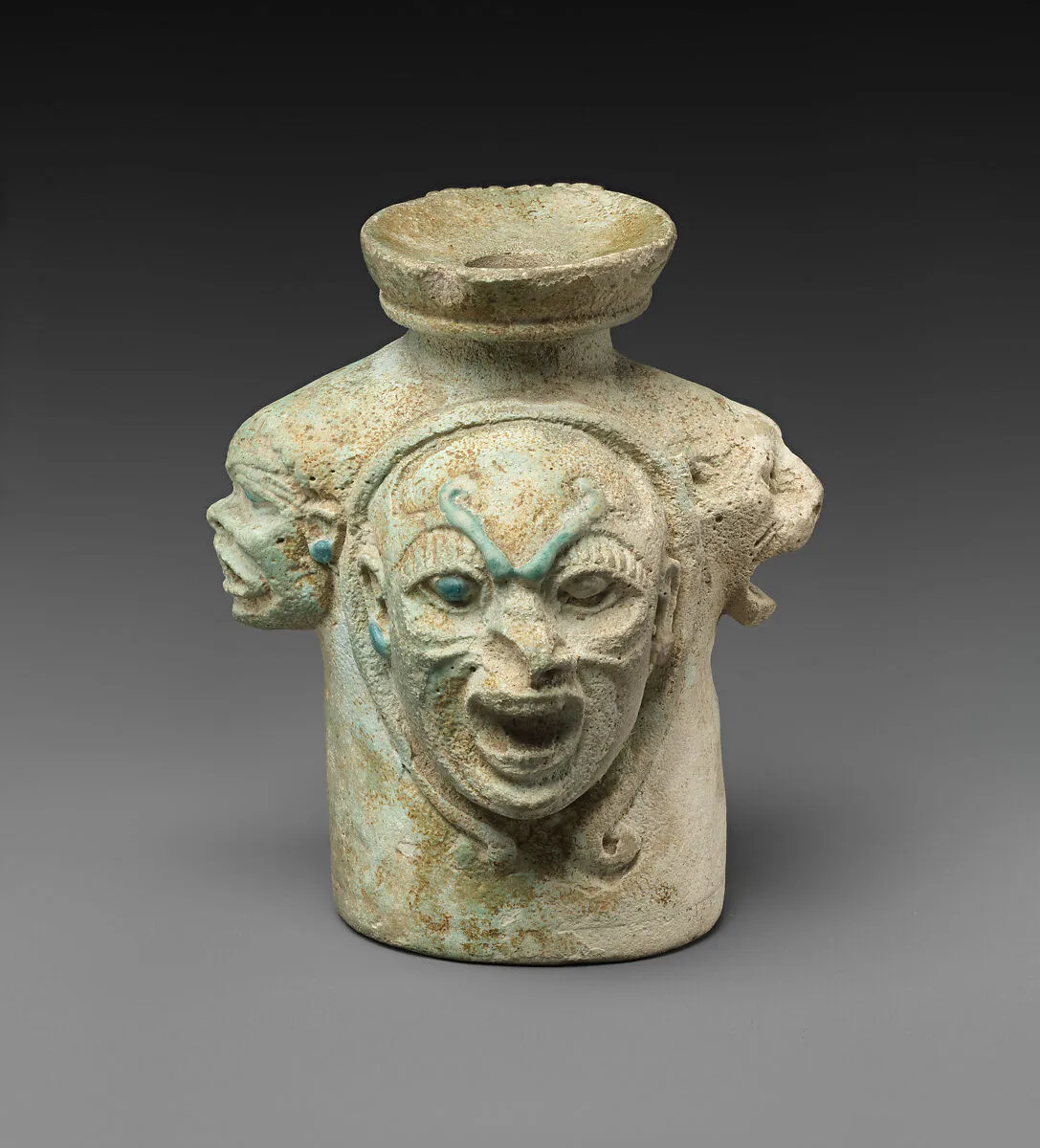 Faience aryballos (perfume vase) in the form of four heads — Unknown