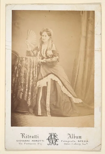 [La Comtesse at Table Holding Fan]