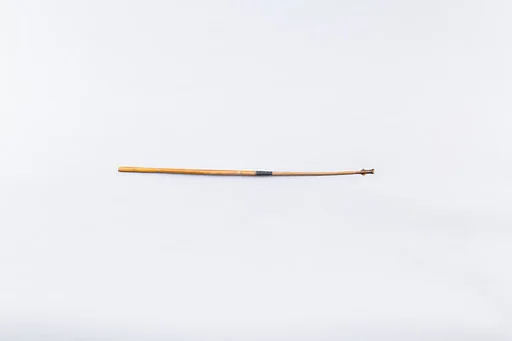 Fragment of an arrow with composite stone tip