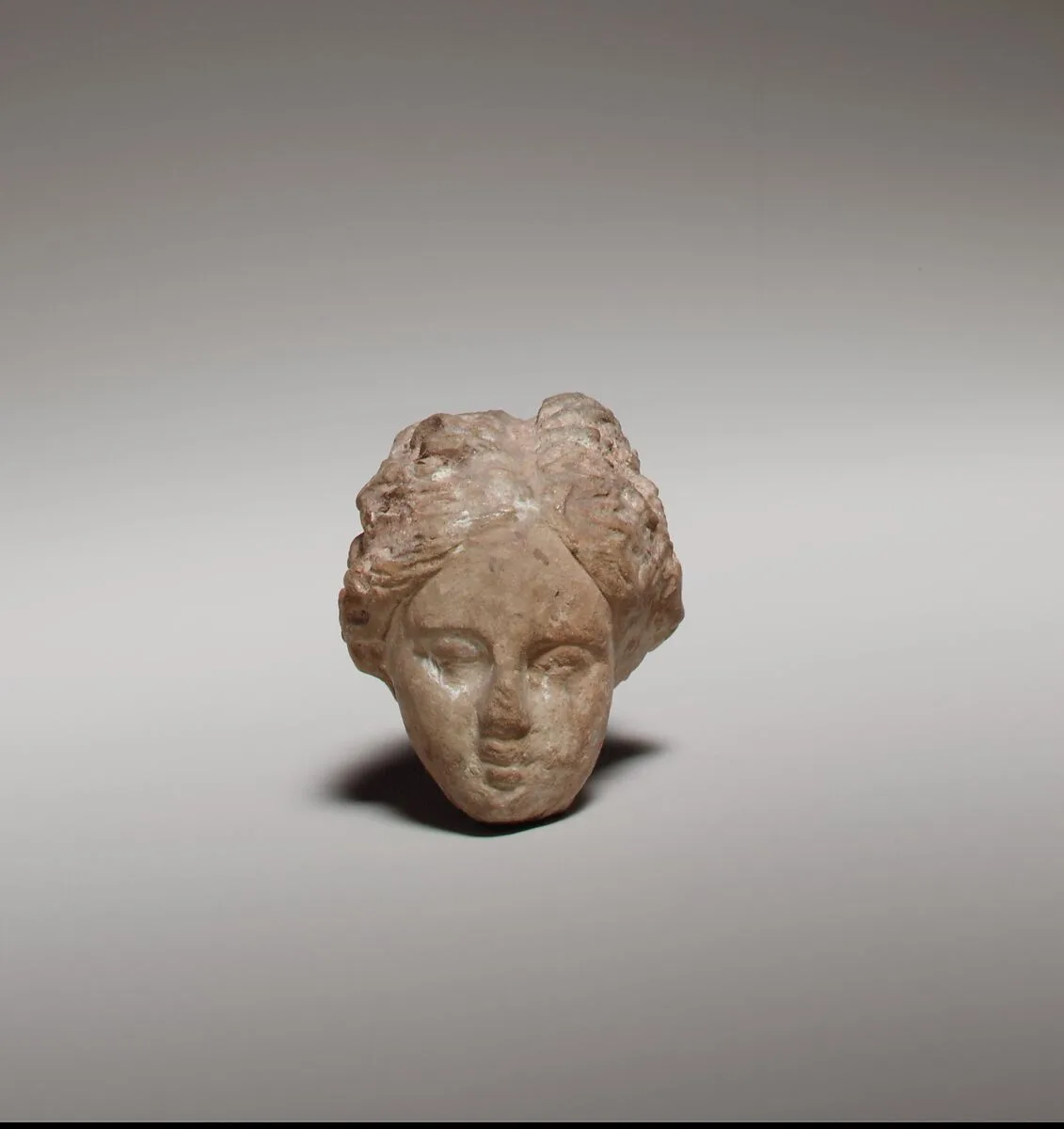 Terracotta head of a woman — Unknown