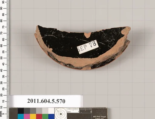Terracotta fragment of a stemless kylix (drinking cup)