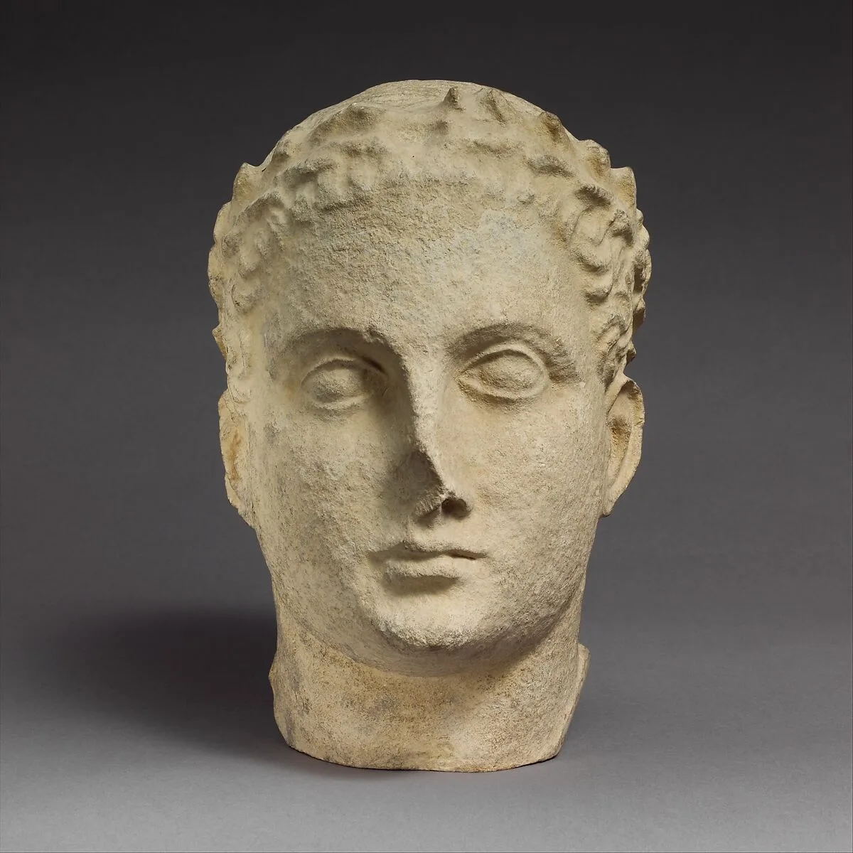 Limestone head of beardless male votary — Unknown