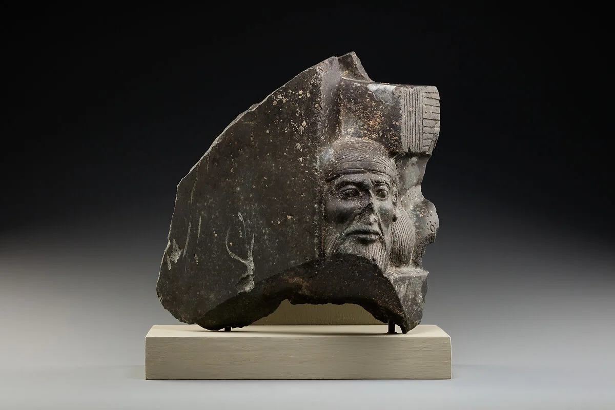 Fragment of a sculptured statue base depicting an Asiatic prisoner — Unknown